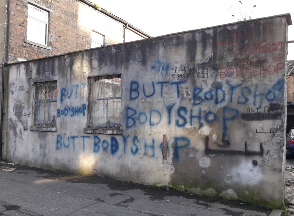 The wall of a garage in Govanhill. It says 'bodyshop' in spray paint, I'm pretending it's a branch of the Body Shop because I'm trying to be funny....